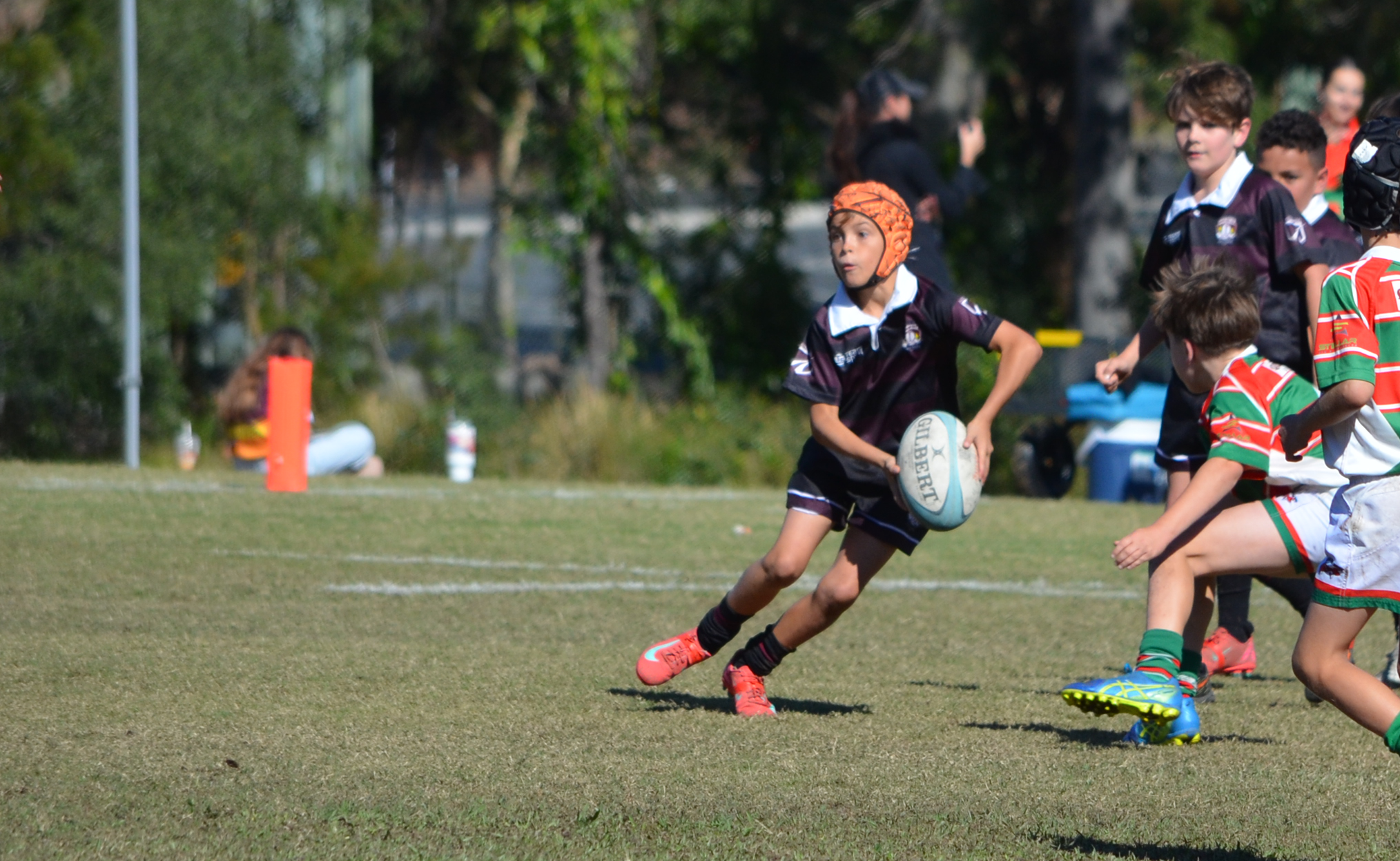 RBC Jnr Player passing ball Junior Rugby Brisbane - Kicker